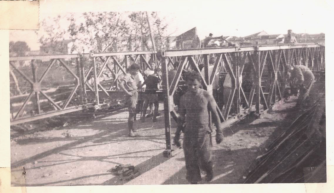 Steve and fellow engineers working on a bailey bridge.jpg